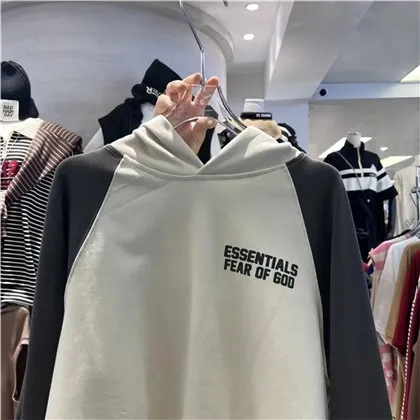 Dessuadora amb caputxa Essentials albercoc